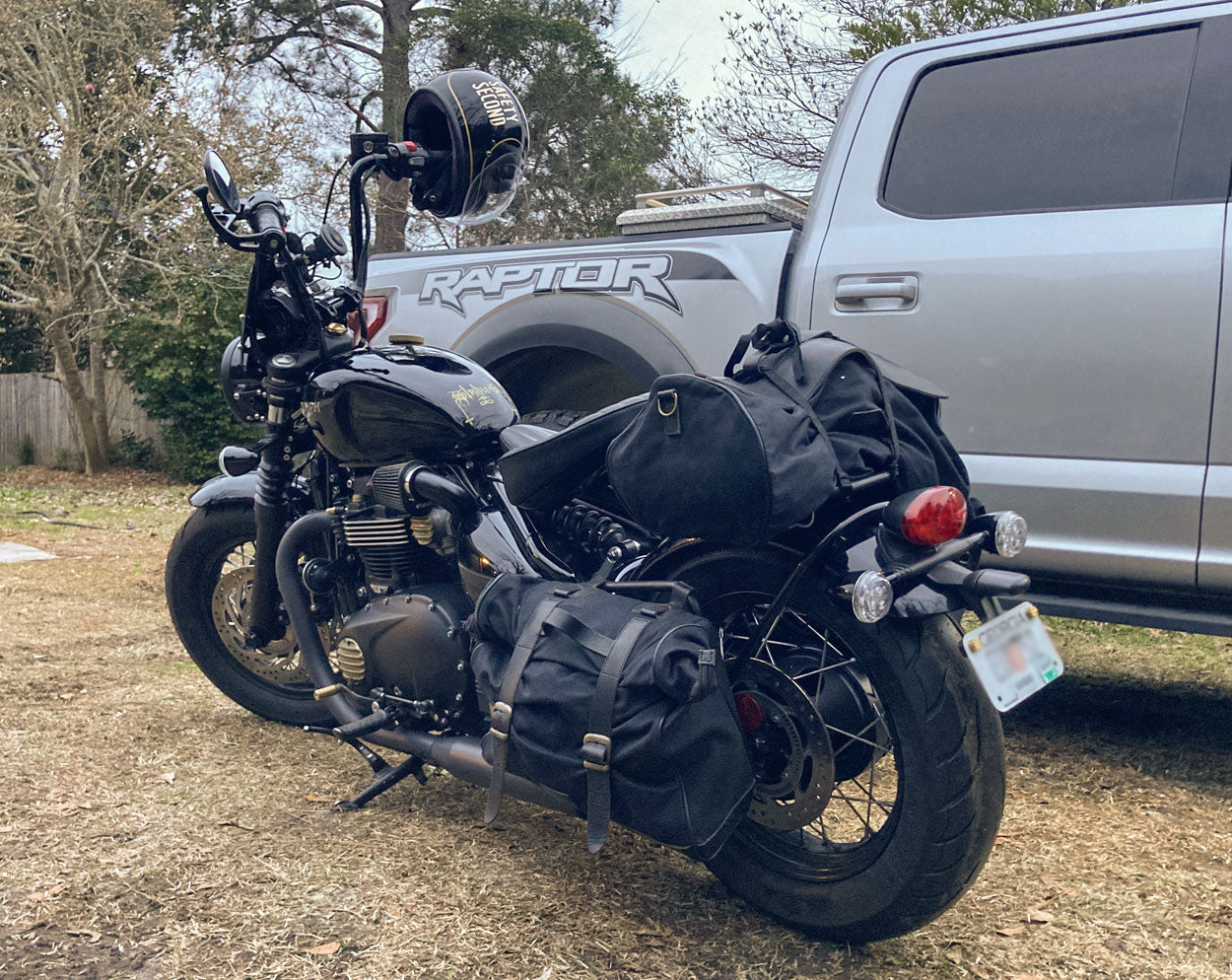 Triumph Bobber black with saddlebags.