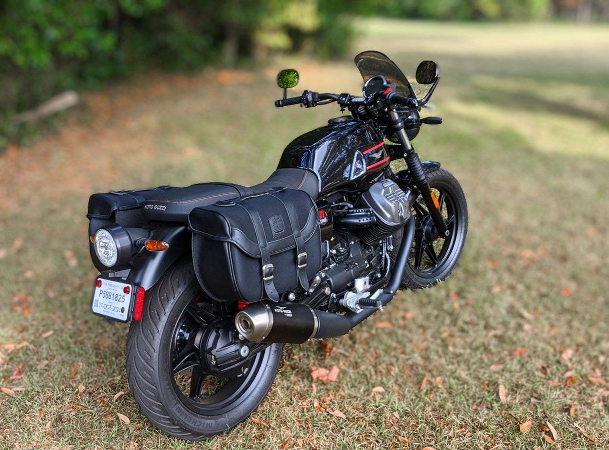 Moto Guzzi V7 850 with black hard panniers.