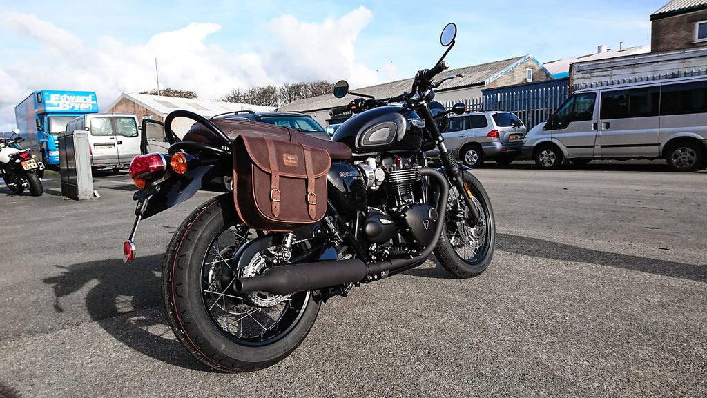 Triumph Bonneville fitted with brown pannier bag.