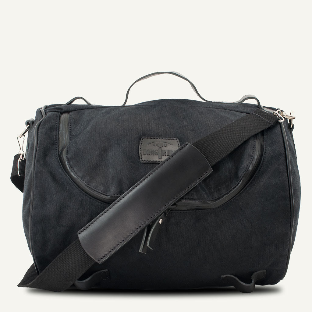 Waterproof waxed-cotton motorcycle tail duffle bag.
