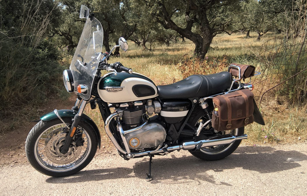 Green and white Spartan Bonneville with saddlebags.