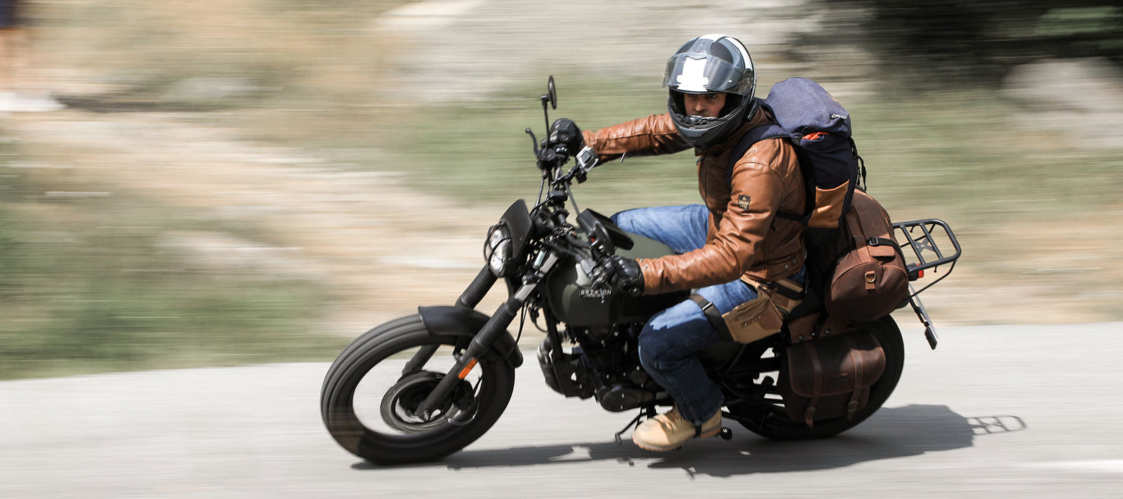 HE'S TOURING FRANCE ON A 125 CC.