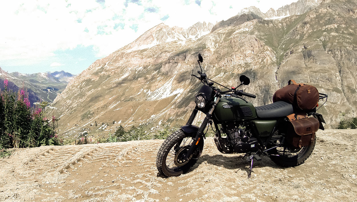 Biker travels on scrambler 125.